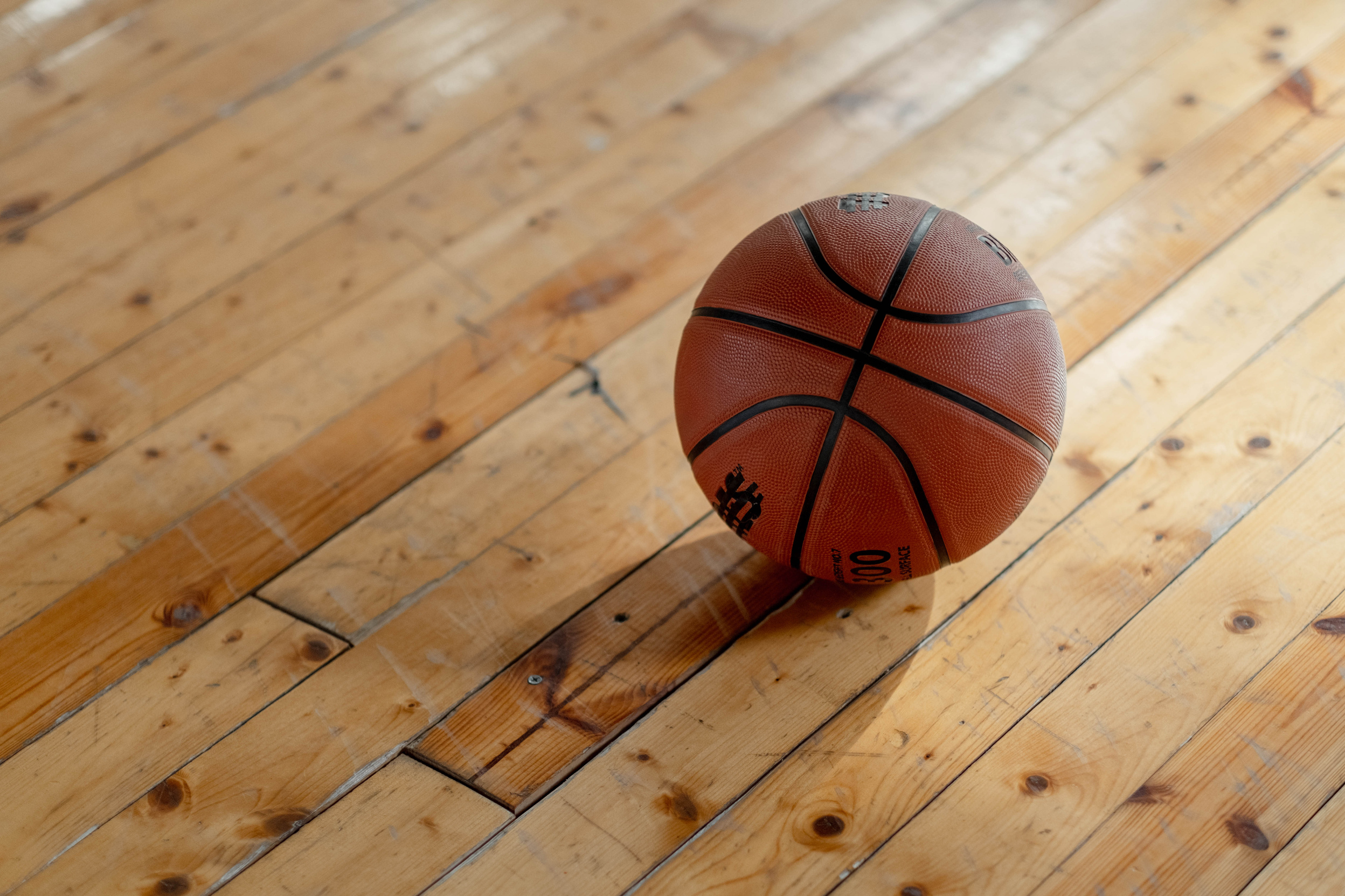 A Basketball on the Wooden Floor 